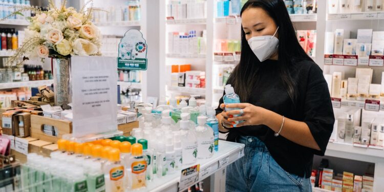 Walgreen enjoys profit, raises forecast, but shares fall on vaccination fears