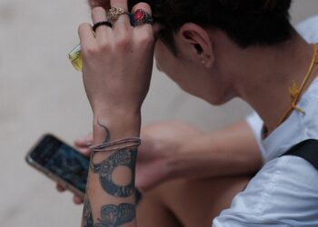 Later payments, higher spending are hurting cash flow, AT&T says