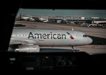 American expects Q3 profits but scales back growth amid disruptions