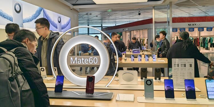 Huawei cuts smartphone capacity to focus on AI chips