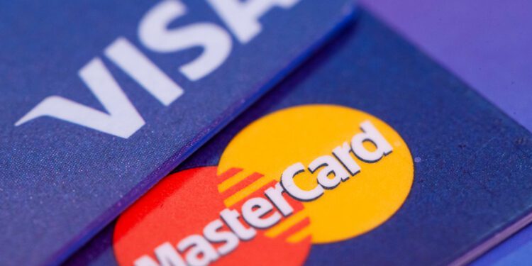 Visa, Mastercard limit swipe fees in class-action settlement - CEO North America Visa, Mastercard limit swipe fees in class-action settlement
