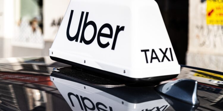 Rivian shares jump as Uber invests $1.25 billion in robotaxi deal